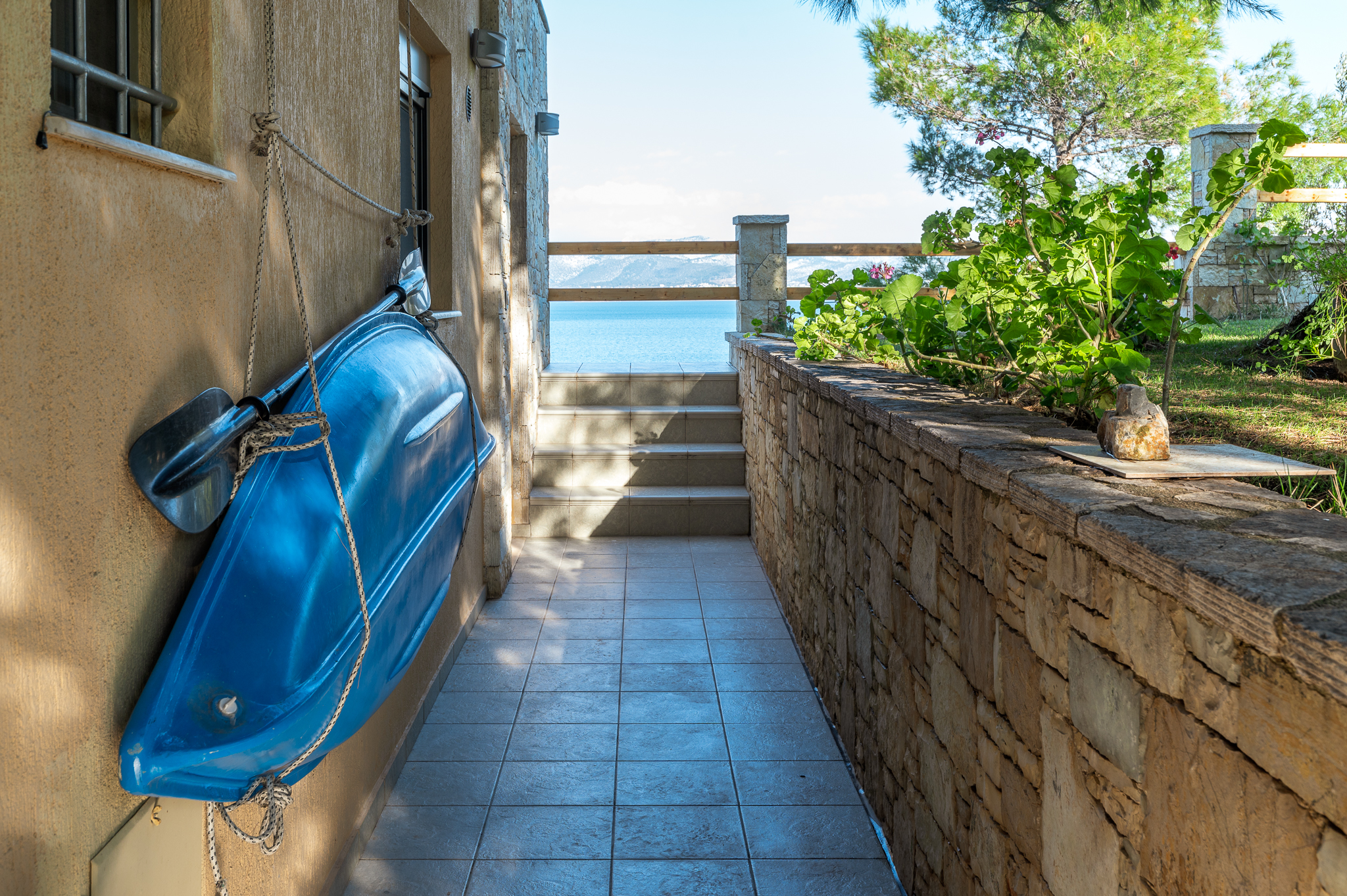 Modern exterior design of Crystal Beach Villa with a well-maintained garden and stylish landscaping